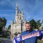 Cameron Tysor in front of the Disney Castle